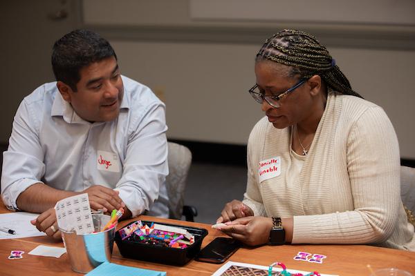 Two educators working together at a table